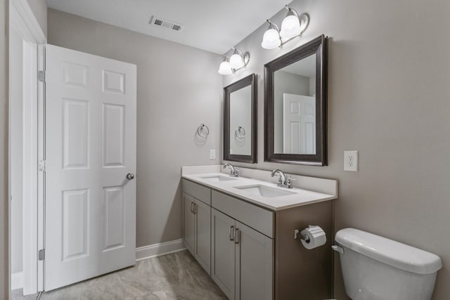 369 Carriage House Ln Unit L509, Hendersonville, TN 37075 - bathroom featuring marble look tile flooring, double vanity, and toilet