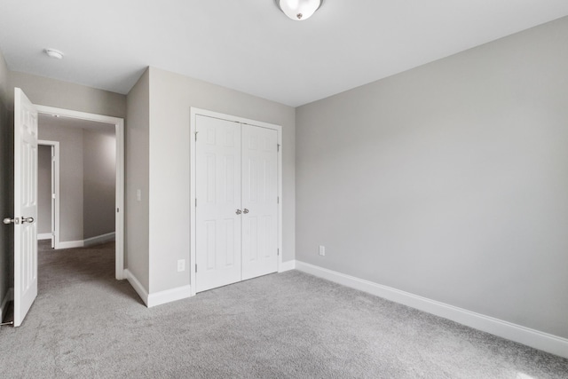 369 Carriage House Ln Unit L509, Hendersonville, TN 37075 - unfurnished bedroom featuring carpet flooring, baseboards, and a closet