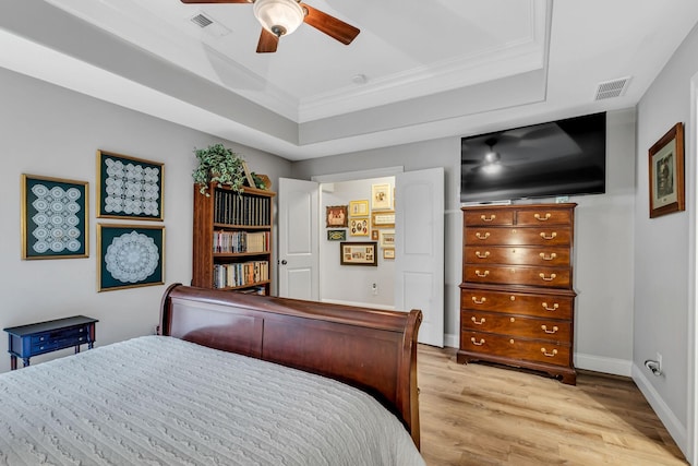 1120 Natchez Valley Ln, Franklin, TN 37064 - bedroom with crown molding, light wood-style floors, a raised ceiling, baseboards, and ceiling fan
