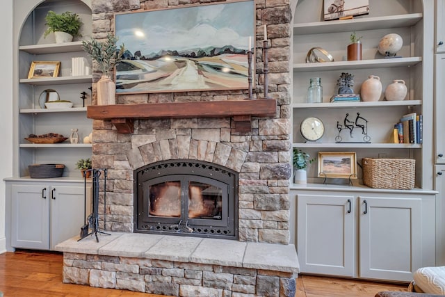 1120 Natchez Valley Ln, Franklin, TN 37064 - living area with a fireplace, light wood finished floors, and built in features
