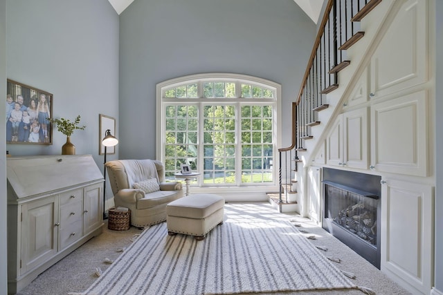 1120 Natchez Valley Ln, Franklin, TN 37064 - carpeted living area featuring high vaulted ceiling and stairs