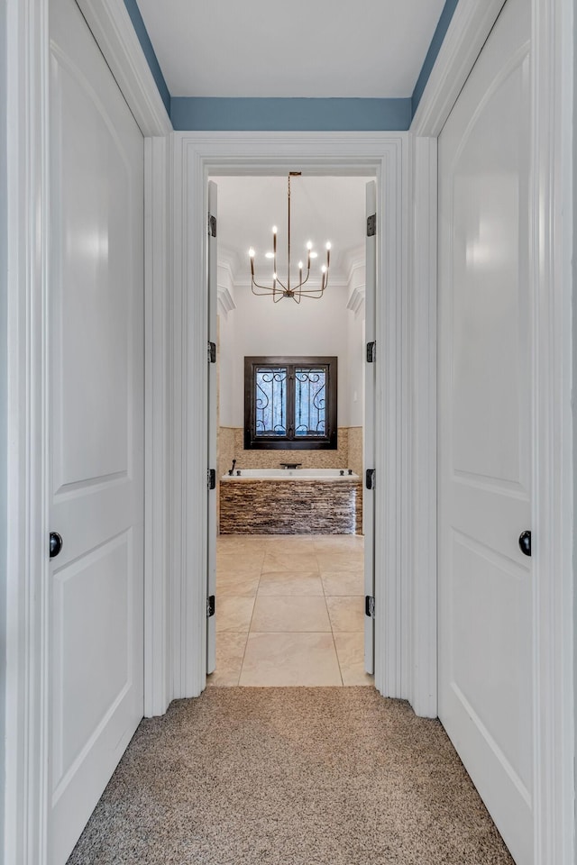 1120 Natchez Valley Ln, Franklin, TN 37064 - hallway featuring a chandelier, light carpet, crown molding, and light tile patterned flooring