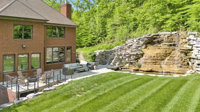 1120 Natchez Valley Ln, Franklin, TN 37064 - view of grassy yard with outdoor lounge area and a patio
