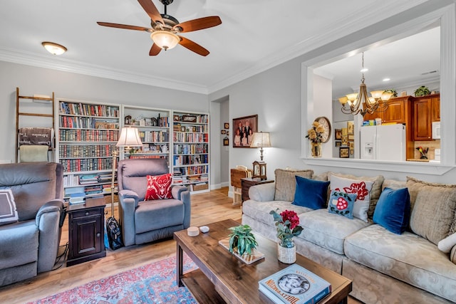1120 Natchez Valley Ln, Franklin, TN 37064 - living area featuring a chandelier, light wood-style flooring, ornamental molding, and a ceiling fan