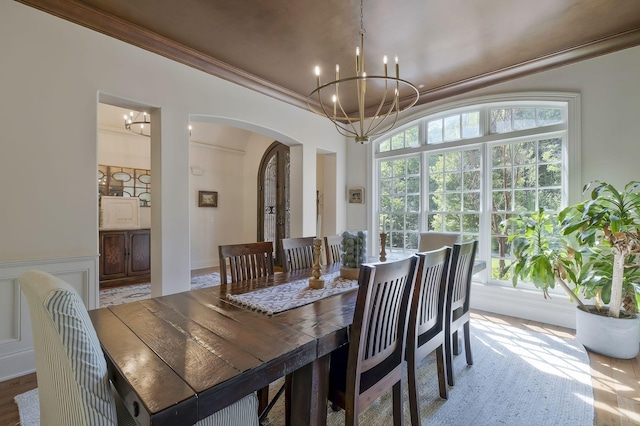 1120 Natchez Valley Ln, Franklin, TN 37064 - dining space featuring arched walkways, a chandelier, and ornamental molding
