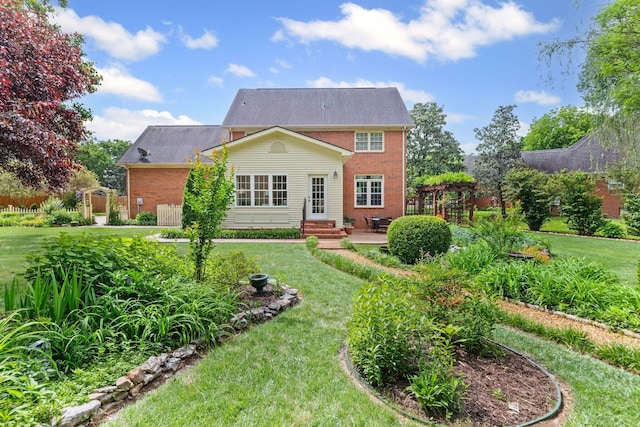 906 Knight Cir, Murfreesboro, TN 37129 - rear view of property featuring brick siding, a patio, a lawn, and entry steps