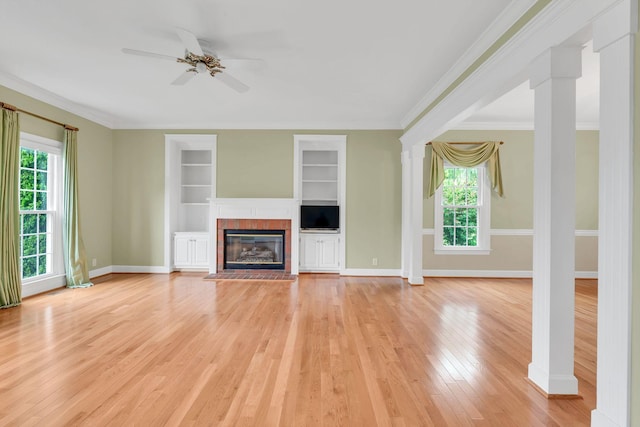 906 Knight Cir, Murfreesboro, TN 37129 - unfurnished living room with a ceiling fan, light wood-style floors, baseboards, built in shelves, and a glass covered fireplace