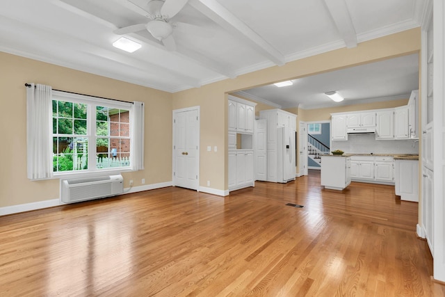 906 Knight Cir, Murfreesboro, TN 37129 - unfurnished living room with ceiling fan, light wood-style floors, stairs, beam ceiling, and a wall mounted air conditioner