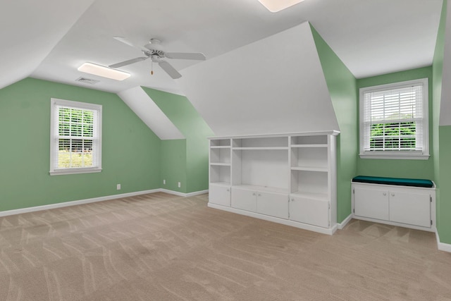 906 Knight Cir, Murfreesboro, TN 37129 - additional living space with light colored carpet, ceiling fan, vaulted ceiling, plenty of natural light, and baseboards