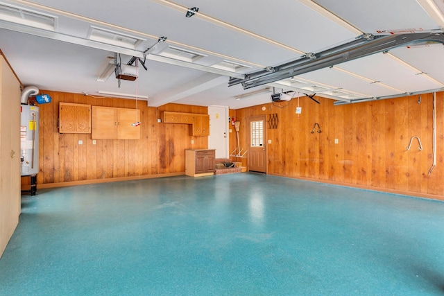 906 Knight Cir, Murfreesboro, TN 37129 - garage with gas water heater, wooden walls, baseboards, and a garage door opener