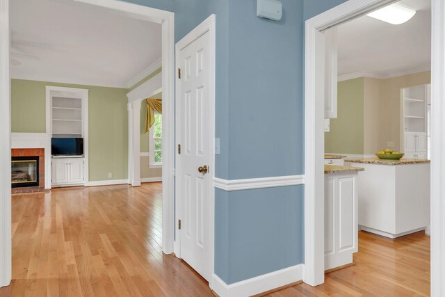 906 Knight Cir, Murfreesboro, TN 37129 - corridor with built in shelves, light wood-type flooring, crown molding, and baseboards