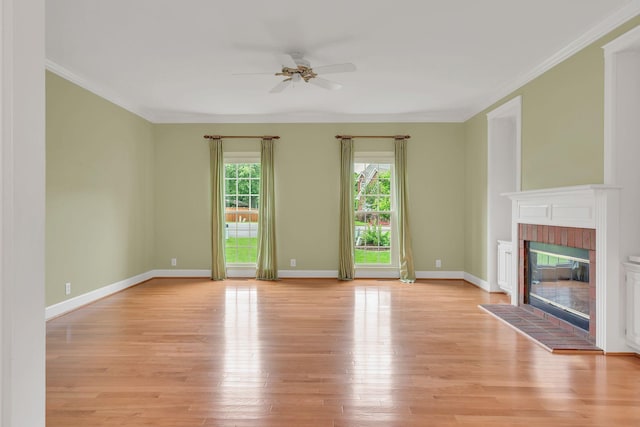 906 Knight Cir, Murfreesboro, TN 37129 - unfurnished living room featuring ceiling fan, light wood-type flooring, a fireplace, crown molding, and baseboards