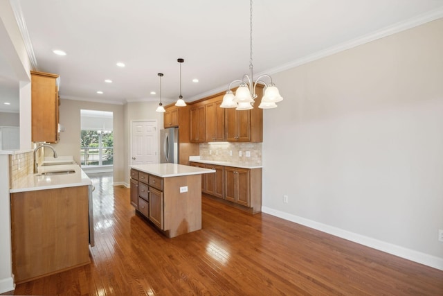 1120 Banbury Ln, Brentwood, TN 37027 - kitchen with a sink, freestanding refrigerator, backsplash, a center island, and recessed lighting