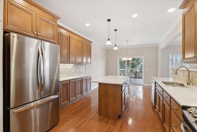 1120 Banbury Ln, Brentwood, TN 37027 - kitchen with appliances with stainless steel finishes, brown cabinetry, a sink, backsplash, and recessed lighting