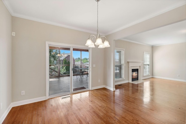 1120 Banbury Ln, Brentwood, TN 37027 - unfurnished living room featuring a chandelier, wood finished floors, baseboards, crown molding, and a fireplace