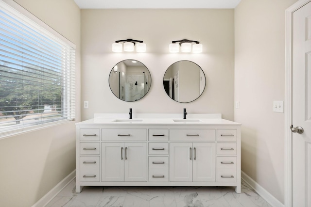 1120 Banbury Ln, Brentwood, TN 37027 - full bathroom with baseboards, marble finish flooring, double vanity, and a shower