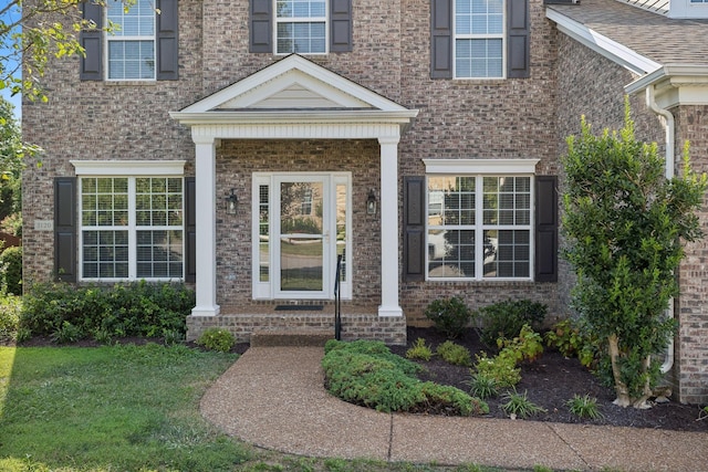 1120 Banbury Ln, Brentwood, TN 37027 - doorway to property featuring brick siding and a lawn
