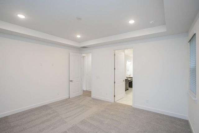 118 W Cassa Way, Mount Juliet, TN 37122 - unfurnished bedroom featuring a tray ceiling, light carpet, recessed lighting, baseboards, and ensuite bath