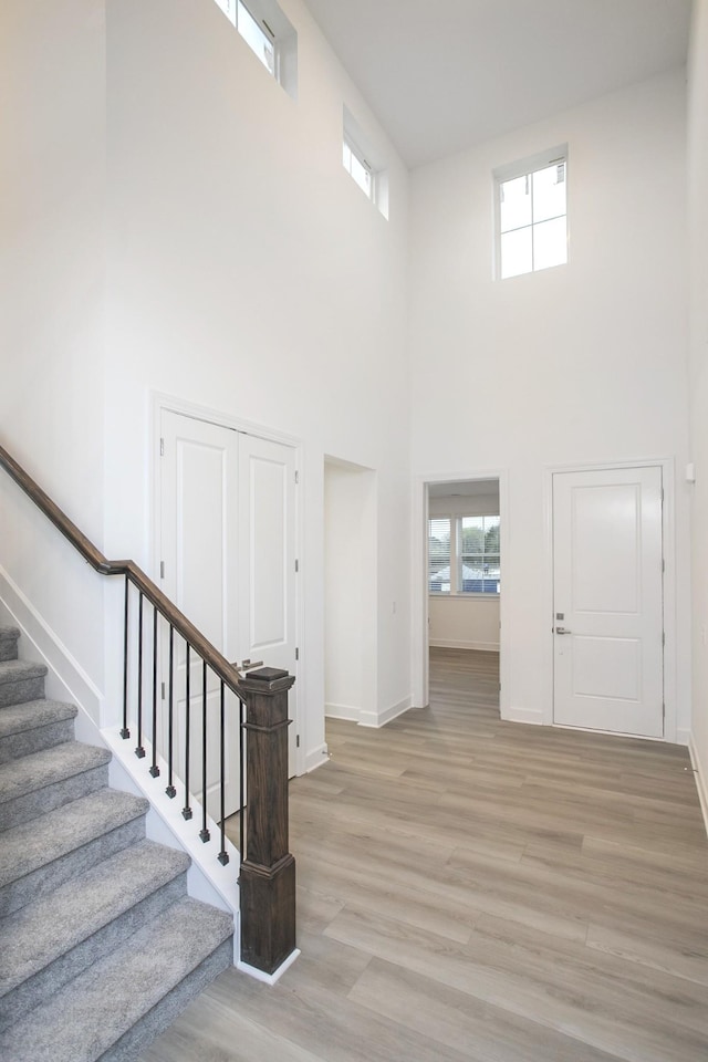 118 W Cassa Way, Mount Juliet, TN 37122 - entrance foyer with a towering ceiling, light wood-style floors, stairs, and baseboards