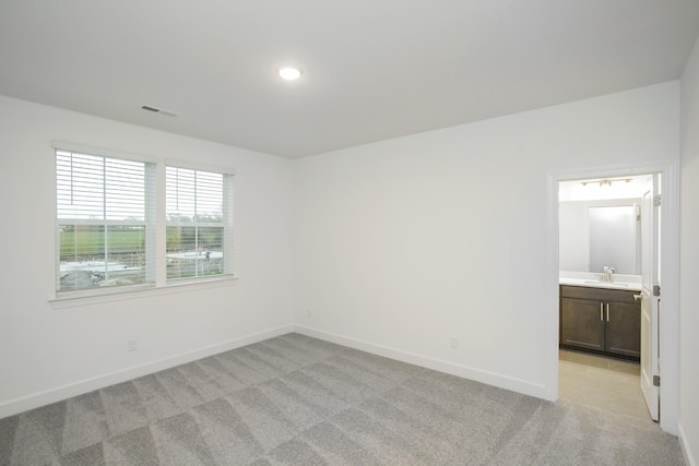 118 W Cassa Way, Mount Juliet, TN 37122 - spare room with light carpet, baseboards, a sink, and recessed lighting