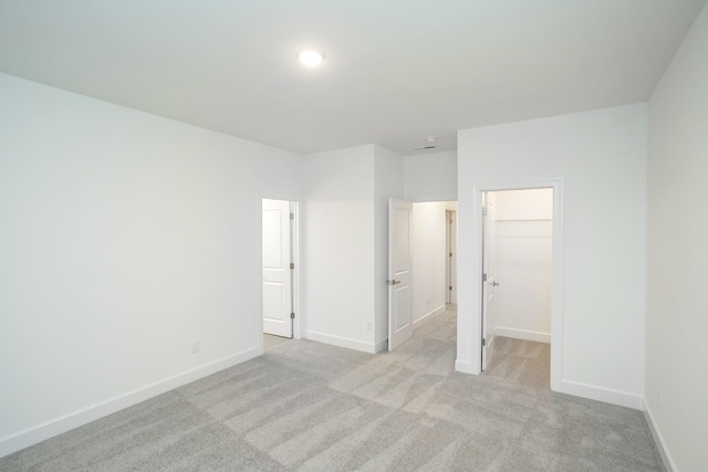 118 W Cassa Way, Mount Juliet, TN 37122 - unfurnished bedroom with a spacious closet, light carpet, baseboards, a closet, and recessed lighting