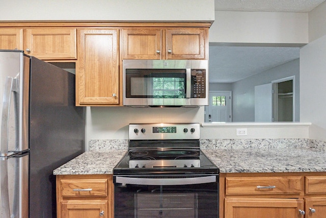 104 Evanmeade Dr, Smyrna, TN 37167 - kitchen with stainless steel appliances and light stone countertops