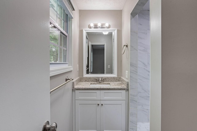104 Evanmeade Dr, Smyrna, TN 37167 - bathroom with vanity, marble look tiles, and a tile shower