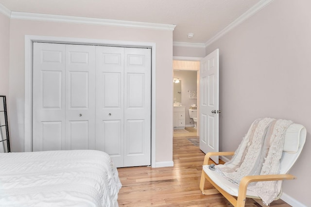 24 Hillcrest Dr, Sparta, TN 38583 - bedroom featuring crown molding, light wood-style floors, a closet, and baseboards