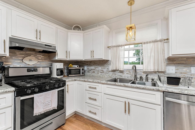 24 Hillcrest Dr, Sparta, TN 38583 - kitchen with appliances with stainless steel finishes, under cabinet range hood, a sink, white cabinetry, and crown molding
