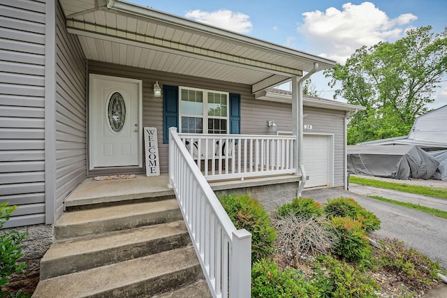 24 Hillcrest Dr, Sparta, TN 38583 - doorway to property featuring covered porch, an attached garage, and driveway