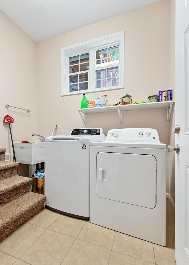 24 Hillcrest Dr, Sparta, TN 38583 - washroom with washing machine and clothes dryer and light tile patterned flooring