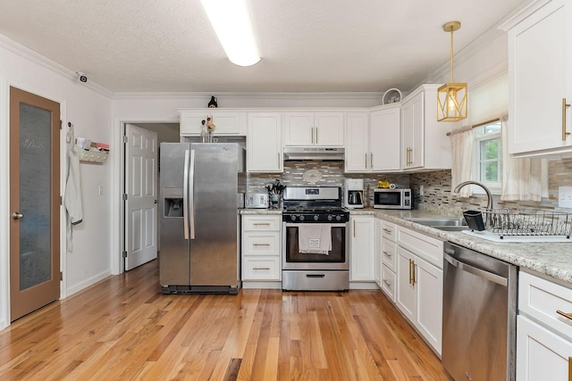 24 Hillcrest Dr, Sparta, TN 38583 - kitchen with stainless steel appliances, under cabinet range hood, a sink, white cabinets, and a textured ceiling