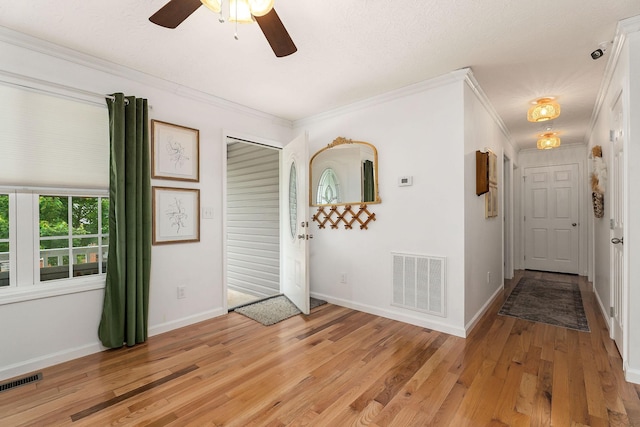 24 Hillcrest Dr, Sparta, TN 38583 - foyer featuring light wood-style floors, ornamental molding, baseboards, and a ceiling fan