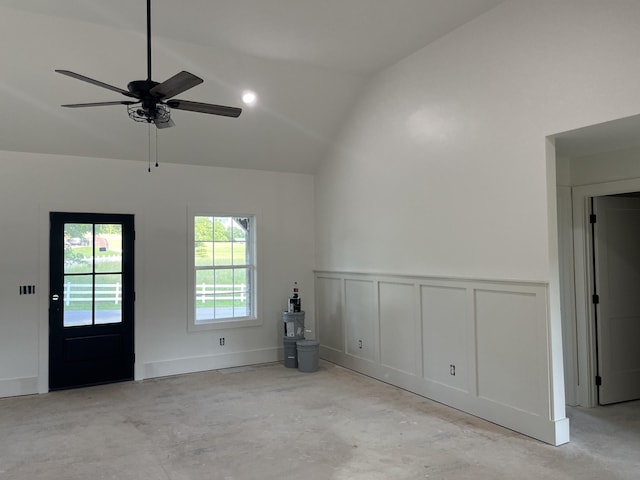52 Hickman Hwy, Gordonsville, TN 38563 - spare room with vaulted ceiling, wainscoting, unfinished concrete floors, ceiling fan, and a decorative wall