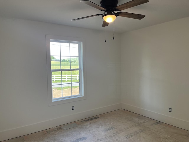 52 Hickman Hwy, Gordonsville, TN 38563 - empty room with baseboards, plenty of natural light, and a ceiling fan