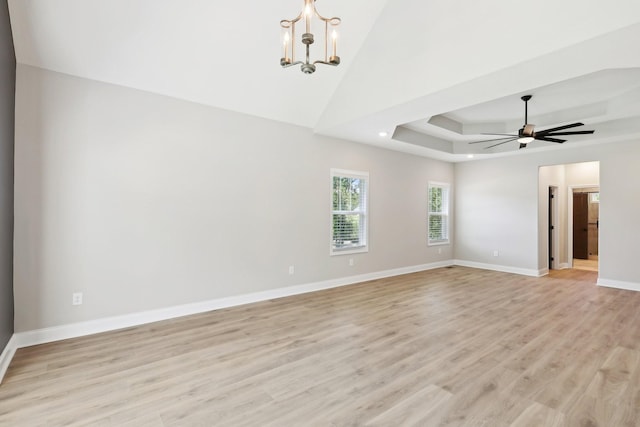 1373 Southside Rd, Southside, TN 37171 - unfurnished room featuring light wood-style floors, a chandelier, baseboards, ceiling fan, and lofted ceiling