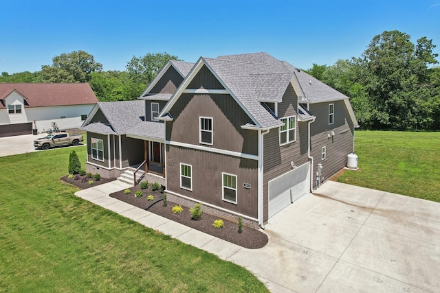 1373 Southside Rd, Southside, TN 37171 - view of front of property featuring concrete driveway, a shingled roof, a front lawn, and a garage