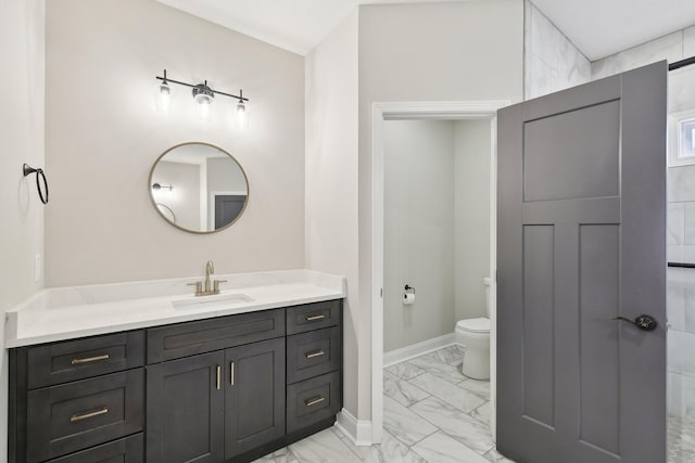 1373 Southside Rd, Southside, TN 37171 - bathroom with marble finish floors, vanity, toilet, and baseboards