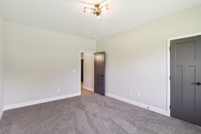 1373 Southside Rd, Southside, TN 37171 - unfurnished bedroom with light colored carpet and baseboards