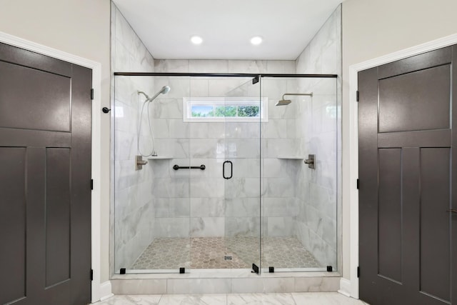 1373 Southside Rd, Southside, TN 37171 - bathroom featuring a shower stall, baseboards, and marble look tile flooring