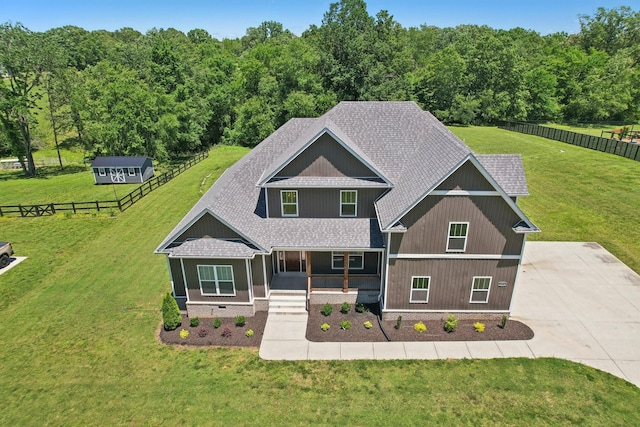 1373 Southside Rd, Southside, TN 37171 - craftsman-style home with a porch, a shingled roof, concrete driveway, and a wooded view