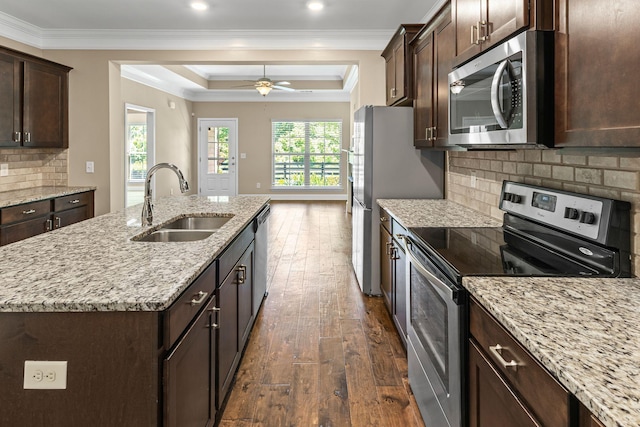 3216 Saltville Aly, Nolensville, TN 37135 - kitchen featuring stainless steel appliances, a sink, dark wood-type flooring, a tray ceiling, and an island with sink