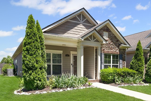 3216 Saltville Aly, Nolensville, TN 37135 - craftsman-style house with a front lawn, stone siding, a porch, and central AC unit