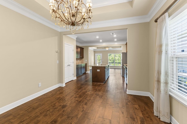 3216 Saltville Aly, Nolensville, TN 37135 - kitchen featuring ornamental molding, dark brown cabinets, an island with sink, dark wood-style flooring, and a chandelier