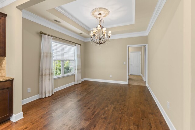 3216 Saltville Aly, Nolensville, TN 37135 - unfurnished dining area featuring a raised ceiling, a chandelier, dark wood finished floors, ornamental molding, and baseboards