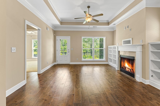 3216 Saltville Aly, Nolensville, TN 37135 - unfurnished living room featuring ceiling fan, a tiled fireplace, healthy amount of natural light, dark wood-style floors, and crown molding