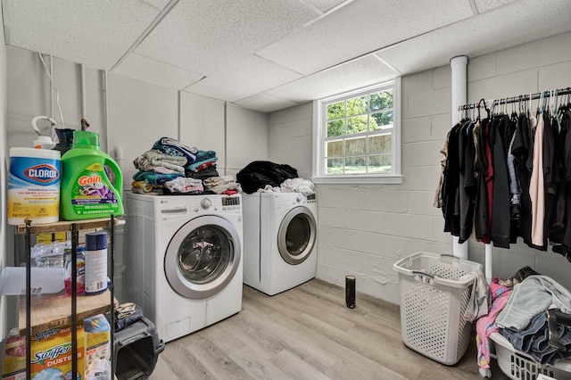 1430 Blythe Ferry Rd NE, Cleveland, TN 37312 - washroom featuring washing machine and dryer, concrete block wall, and light wood-style floors