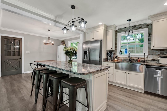 1430 Blythe Ferry Rd NE, Cleveland, TN 37312 - kitchen featuring black refrigerator with ice dispenser, stainless steel dishwasher, a sink, backsplash, and light wood-type flooring