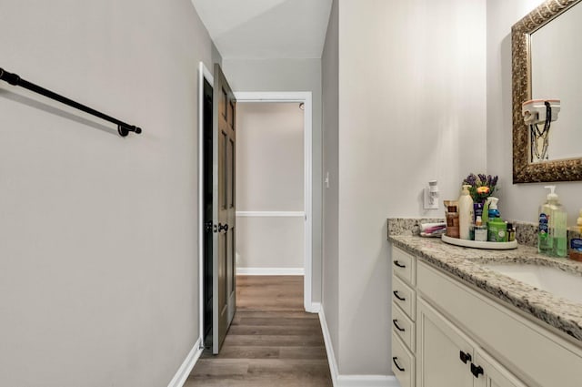 1430 Blythe Ferry Rd NE, Cleveland, TN 37312 - bathroom with vanity, wood finished floors, and baseboards