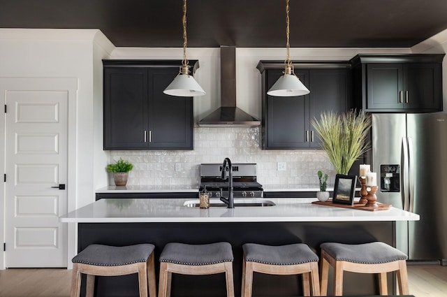 326A E Trinity Ln, Nashville, TN 37207 - kitchen featuring stainless steel fridge with ice dispenser, wall chimney exhaust hood, a sink, a breakfast bar area, and light countertops